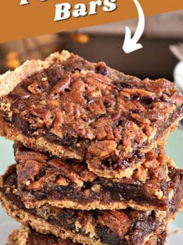 a stack of chocolate pecan pie bars