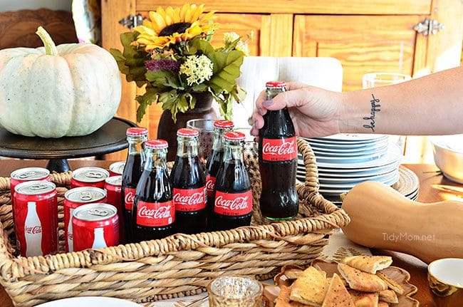 holiday table with Coca-Cola bottles and cans