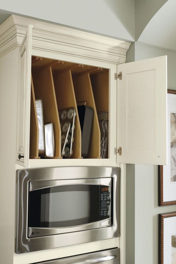 Storing party trays, serve ware and even seldom used bakeware is ideal above the oven, using our Oven Cabinet with Tray Dividers built right in to the top of the cabinet.