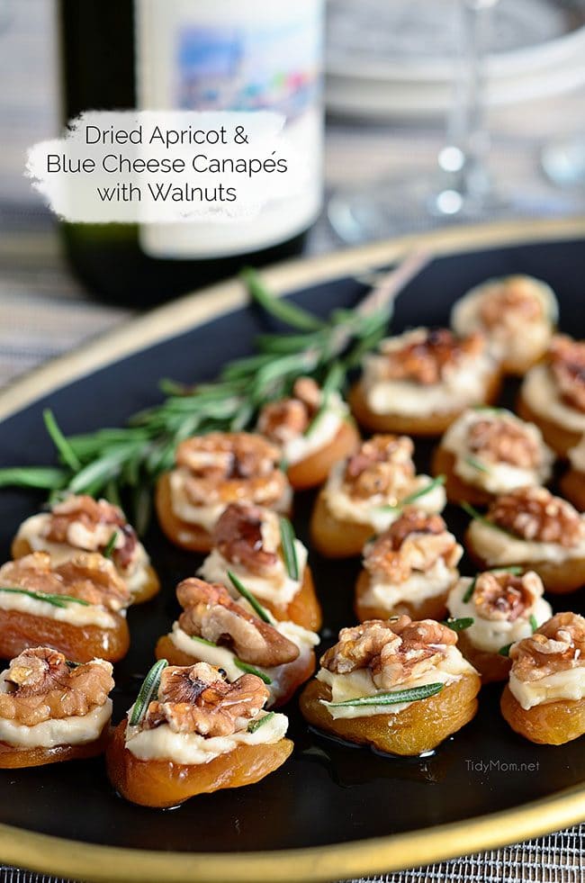 Dried Apricot Blue Cheese Canapes with Walnuts on black platter