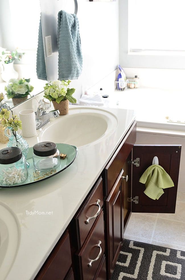  a microfiber cloth on the bathroom vanity door to clean the mirror and faucet daily. Tips on how to keep your house clean.