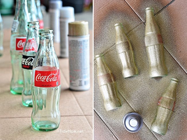 Use empty Cocoa Cola bottles as a pretty holiday table centerpiece. Just paint with glitter spray paint and add some holiday florals, and arrange on a tray. Easy and costs almost nothing! details at TidyMom.net