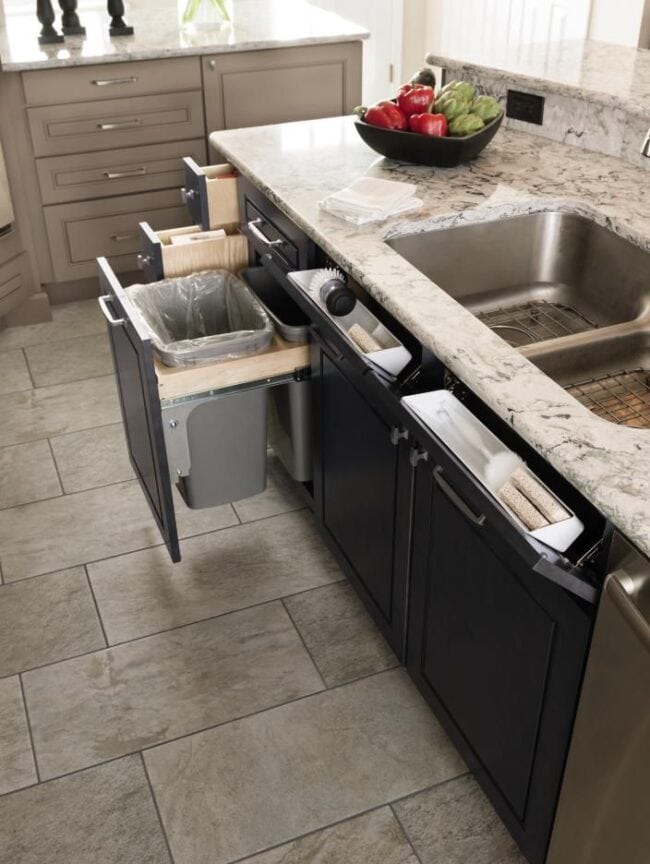 Wastebasket and Tilt Out Drawers: Tilt out drawers are nice to store a sponge or drop rings into while doing dishes, making use of false drawer fronts. And wastebasket keeps your trash out of site but easily accessible.