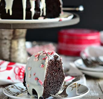 Chocolate Peppermint Brownie Cake uses a box cake mix + brownie mix! Easy recipe at TidyMom.net