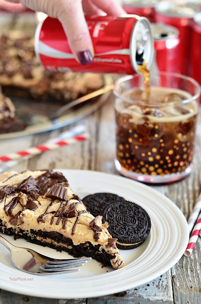 slice of Brownie Pizza with a glass of Coca-Cola