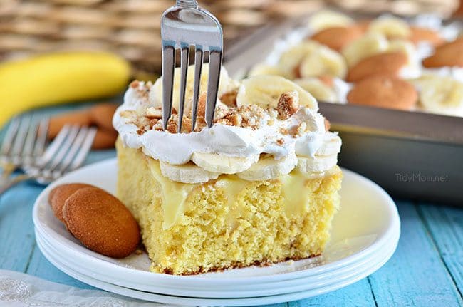 fork going into a piece of Banana Pudding Poke Cake 