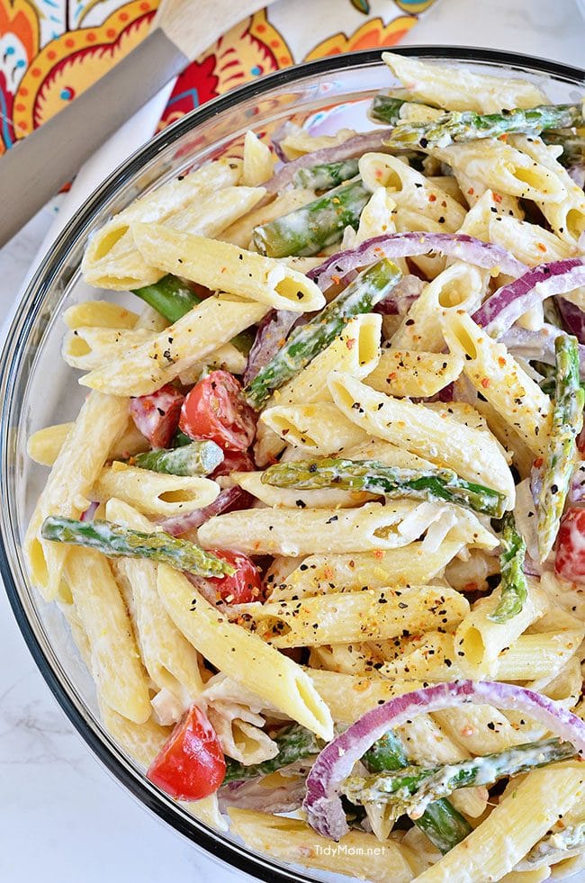 Creamy Asparagus Pasta Salad comes with an extra punch of flavor from fresh lemon juice and makes a perfect spring side dish. Add grilled chicken and it could be a meal all on it’s own. Recipe at TidyMom.net