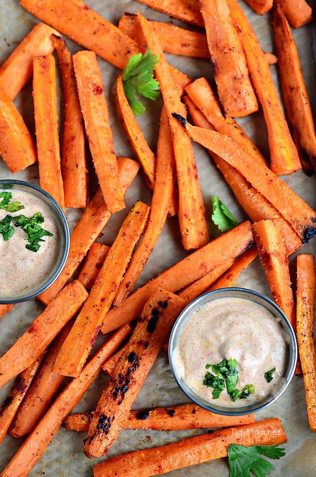 Grilled Carrots with little cups of Chipotle Lime Dip on a tray 