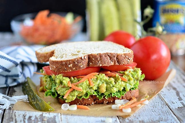 Avocado and chickpeas together make the most delicious sandwich spread! Get this Sweet Heat Chickpea Avocado Salad Sandwich recipe at TidyMom.net