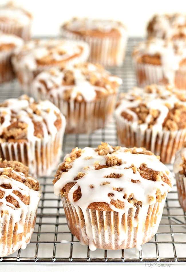 Apple Spice Muffins on cooling rack with white icing dripping down