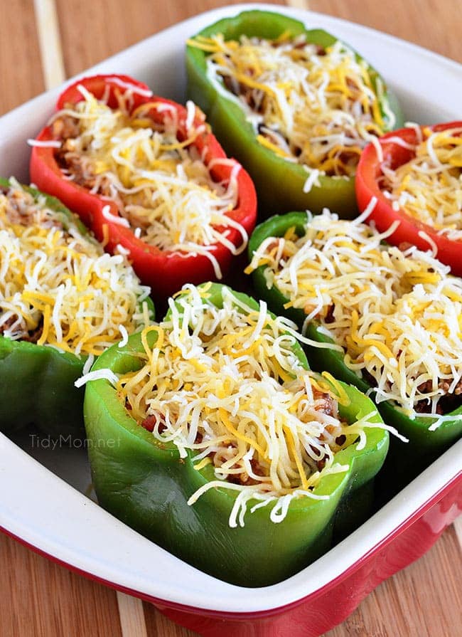 Bell peppers are filled with rice, browned ground beef, black beans, tomatoes, green chilies and cheese for an easy weeknight dinner with a southwest twist.