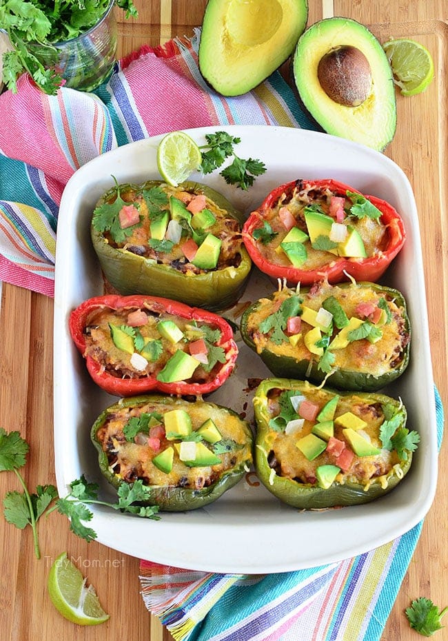 Fresh Bell peppers are filled with rice, browned ground beef seasoned with McCormick Organic Taco Seasoning, black beans, tomatoes, green chilies and cheese for an easy weeknight dinner with a southwest twist. Southwest Stuffed Peppers recipe at TidyMom.net