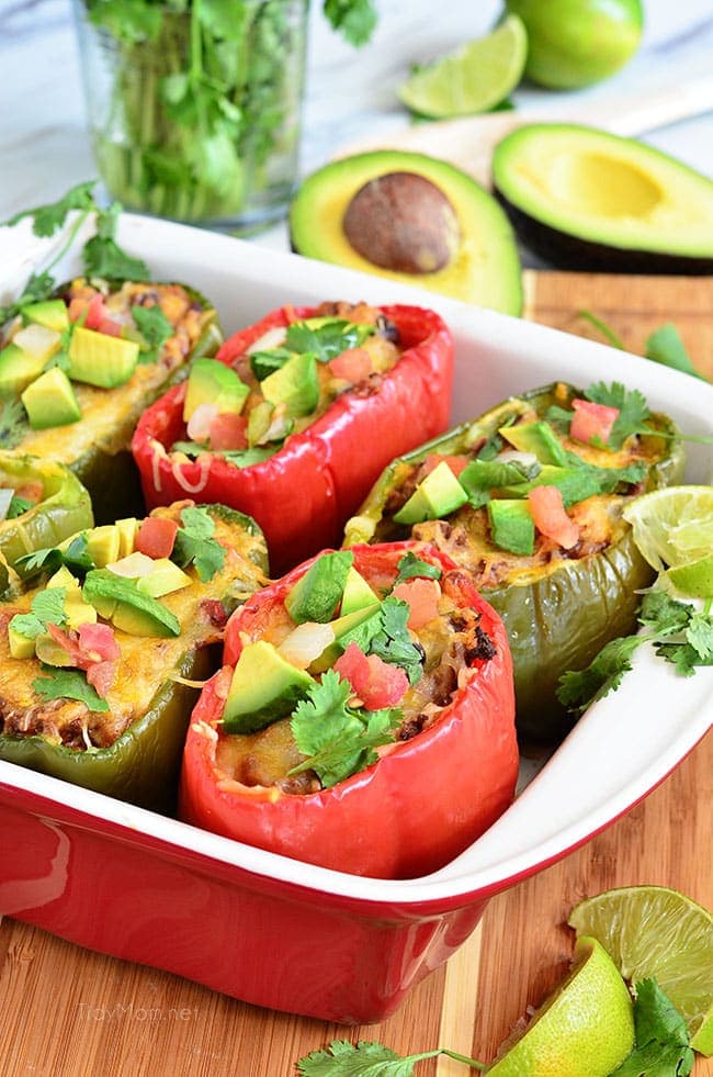 Fresh Bell peppers are filled with rice, browned ground beef seasoned with McCormick Organic Taco Seasoning, black beans, tomatoes, green chilies and cheese for an easy weeknight dinner with a southwest twist. Southwest Stuffed Peppers recipe at TidyMom.net