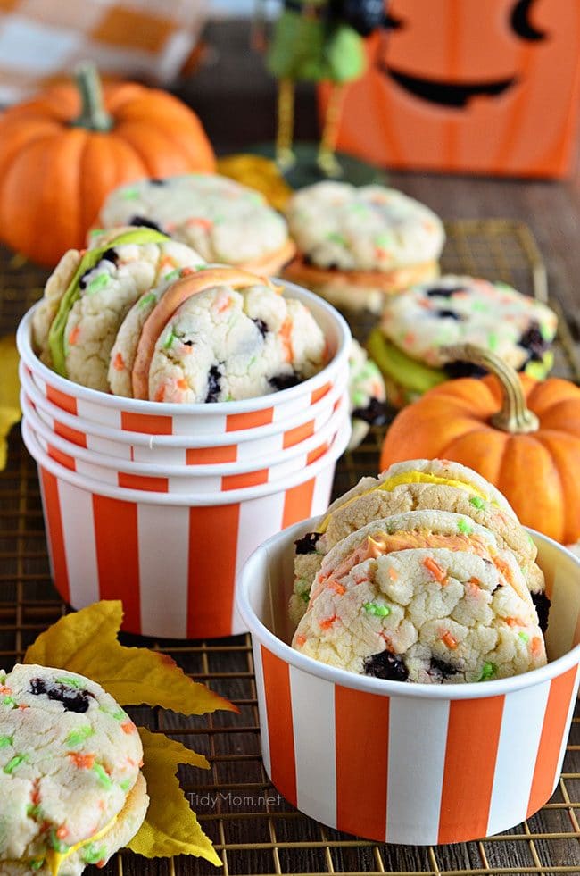 Funfetti Whoppie Pies are an easy and delicious cookie treat thanks to a box cake mix and canned frosting. Add seasonal sprinkles and food color to frosting. Get the recipe for these Halloween Funfetti Whoppie Pies at TidyMom.net