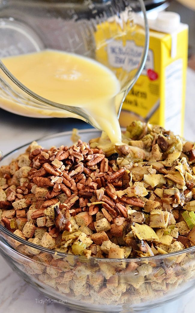 Slow Cooker Stuffing with artichokes, mushrooms and toasted pecans. Easy, flavorful and perfect for any holiday meal. Get the recipe at TidyMom.net