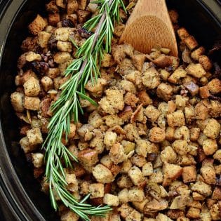 Slow Cooker Stuffing with artichokes, mushrooms and toasted pecans. Easy, flavorful and perfect for any holiday meal. Get the recipe at TidyMom.net