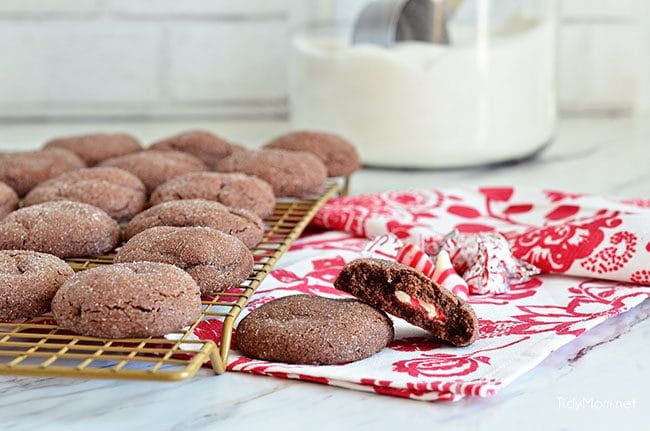 Super soft chocolate cookies hold a peppermint kiss in the center in these Peppermint Surprise Crinkle Cookies. So delicious