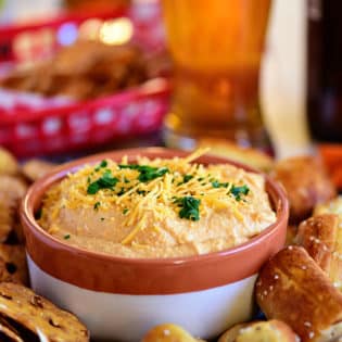 cheese dip with beer and pretzels