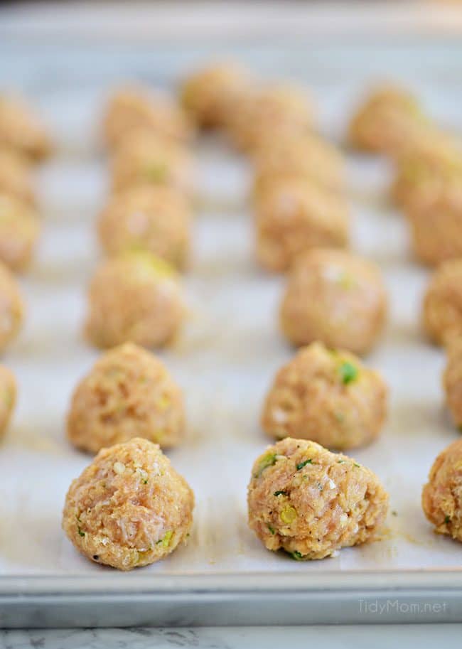 uncooked Buffalo Chicken Meatballs on a baking sheet