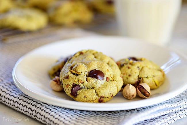 Pistachio cookies are sure to become a favorite! Perfect for St. Patricks Day, Easter, Christmas or any day. These deliciously soft pudding cookies are buttery and salty with dark chocolate chunks that pairs perfectly with chopped pistachios. I bet you can’t eat just one! Get the full printable recipe at TidyMom.net