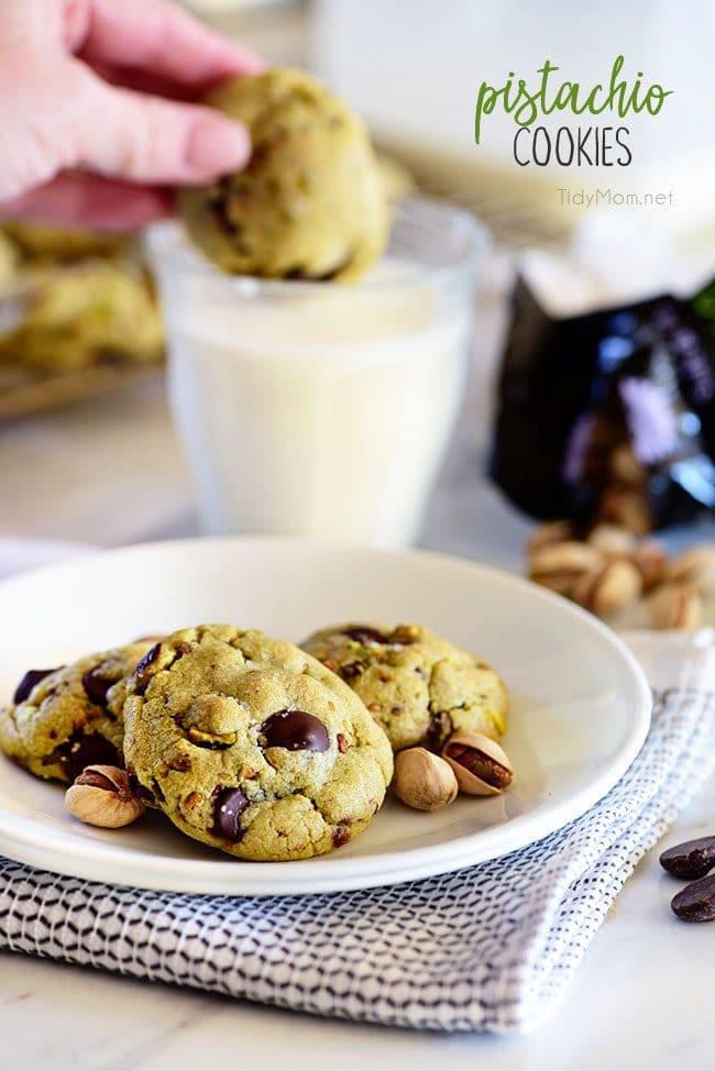 Pistachio cookies are sure to become a favorite! Perfect for St. Patricks Day, Easter, Christmas or any day. These deliciously soft pudding cookies are buttery and salty with dark chocolate chunks that pairs perfectly with chopped pistachios. I bet you can’t eat just one! Get the full printable recipe at TidyMom.net