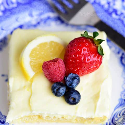 This no-fuss lemon sheet cake is super moist and makes a wonderful spring or summer dessert that easily feeds a crowd. It may not be a fancy cake, but each slice is pure lemon bliss! print full recipe at TidyMom.net