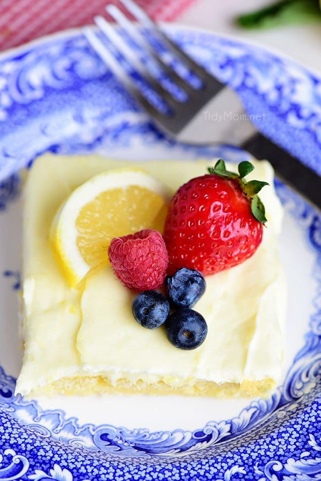 This no-fuss lemon sheet cake is super moist and makes a wonderful spring or summer dessert that easily feeds a crowd. It may not be a fancy cake, but each slice is pure lemon bliss! print full recipe at TidyMom.net