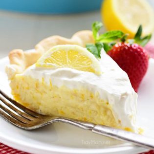 This Meyer Lemon Pie packs a ton of lemon flavor with a fluffy texture to a simple homemade dessert. Pops of sweet tangy Meyer lemons are perfect for spring. The pie is not overly sweet and has lots of citrus love all the way through to the homemade whipped cream for the top! Get the full printable recipe at TidyMom.net