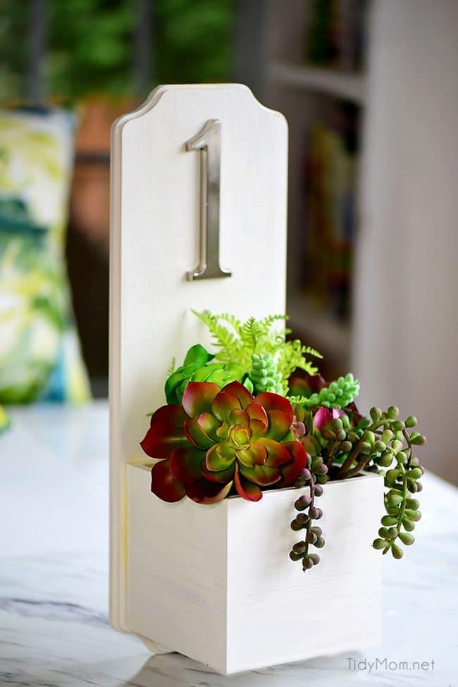 Increase your curb appeal with an address planter box. This DIY house number is super simple and quick to make and doesn’t require any tools. Get the full tutorial at TidyMom.net