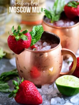 Strawberry Basil Moscow Mule is the perfect summer cocktail. Made like a traditional Moscow Mule with vodka, ginger beer and lime, with the addition of muddled fresh strawberries and basil. Print the recipe at TidyMom.net