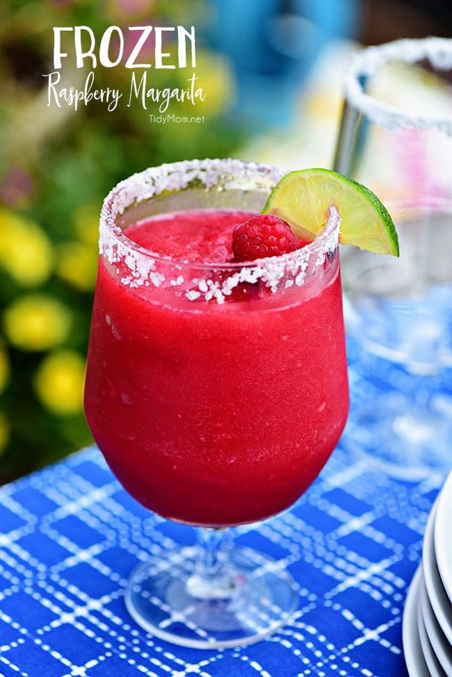 Frozen Raspberry Margarita is the perfect summer cocktail. Raspberry sorbet puts a refreshing twist on the traditional margarita, for a cool party sip! Get the full recipe at TidyMom.net - always a hit!