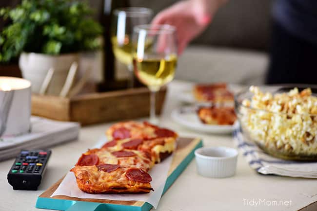 Pizza and Popcorn Movie Night. Make Gourmet Popcorn at home for a special treat. Oven-ready pizza, Sweet Heat Maple-Chili Popcorn, something to sip on and your favorite movie and you have a perfect date night at home. Print the gourmet popcorn recipe at TidyMom.net