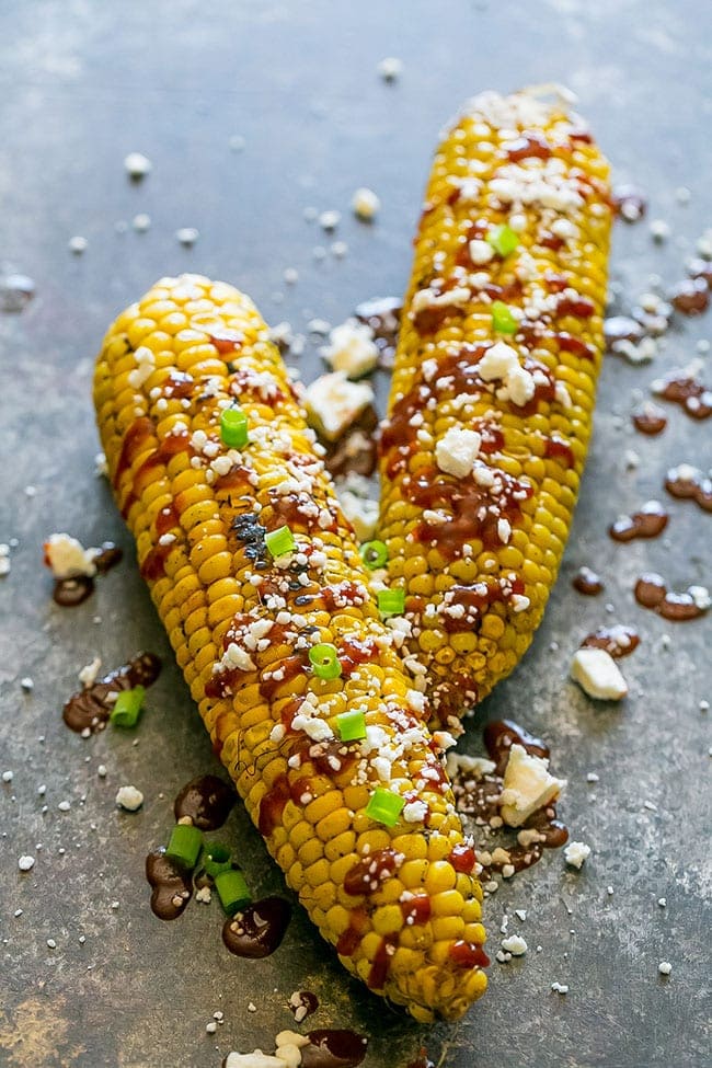Sriracha Grilled Corn image from Sweet C's Designs: How to Plan a Perfect Picnic. Get recipes, printables and more to plan a perfect picnic at TidyMom.net