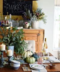 Seasonal Simplicity — Blue and Green Fall Tablescape with simple eucalyptus and pumpkins fall centerpiece . Get all the details along with 20+ Fall Home Tours at TidyMom.net