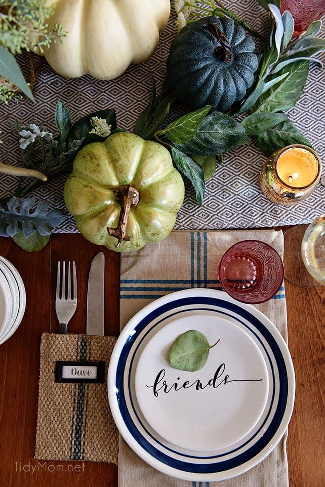 Friends Plate and Pumpkin: Seasonal Simplicity — Blue and Green Fall Tablescape with simple eucalyptus and pumpkins fall centerpiece . Get all the details along with 20+ Fall Home Tours at TidyMom.net