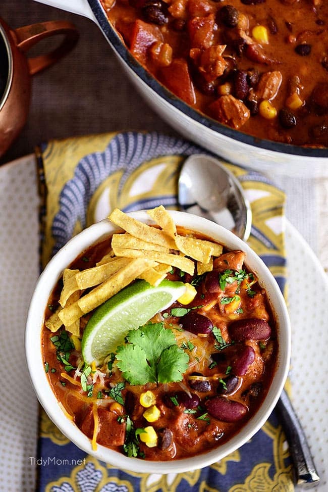 This flavorful Creamy Taco Chili is packed with lots of beans, chicken and other taco inspired ingredients. The perfect way to warm up on a chilly day! Printable recipe + video at TidyMom.net