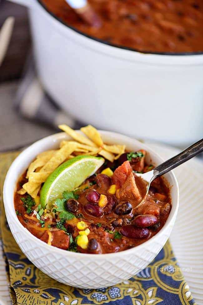 This flavorful Creamy Taco Chili is packed with lots of beans, chicken and other taco inspired ingredients. The perfect way to warm up on a chilly day! Printable recipe + video at TidyMom.net