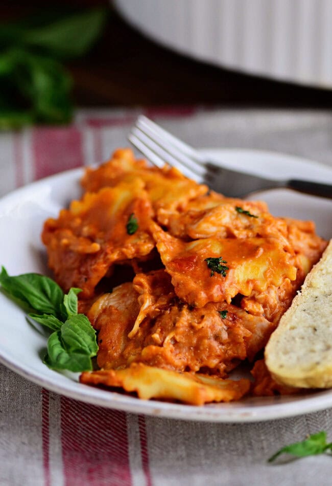 Cheesy Chicken Ravioli Bake on a plate with a fork