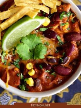 chili in a bowl with taco toppings