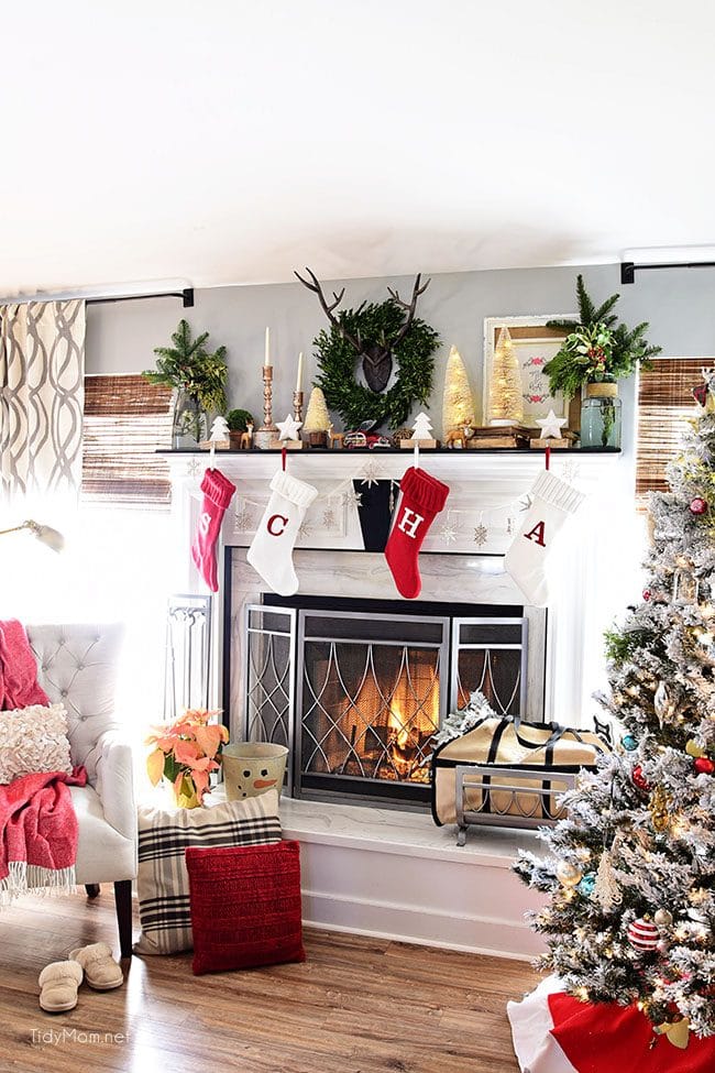 Merry and Bright Christmas Mantel Decor with rustic neutrals and a touch of red and green. Details at TidyMom.net