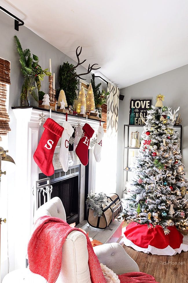 Merry and Bright Christmas Mantel Decor with rustic neutrals and a touch of red and green. Details at TidyMom.net