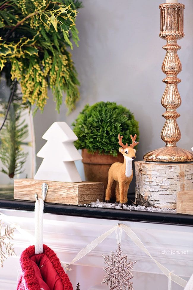 Deer + Tree Stocking Holder. Merry and Bright Christmas Mantel Decor with rustic neutrals and a touch of red and green. Details at TidyMom.net