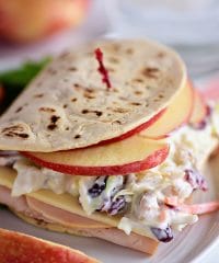 A favorite Panera restaurant sandwich gets a little healthier when you make it at home! Turkey, white cheddar, crisp apple slices, and a crunchy tangy slaw are slipped into a flatbread sandwich. This Turkey, Apple & Cheddar Sandwich is packed with flavor and makes a quick, easy and delicious meal! Print the full recipe at TidyMom.net