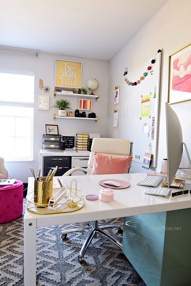 Decorating a shared office, with colorful industrial style. Her side is pink and gold, while his is black and neutrals. Check out the gold coffee cart!! Get all the details of this shared home office space at TidyMom.net