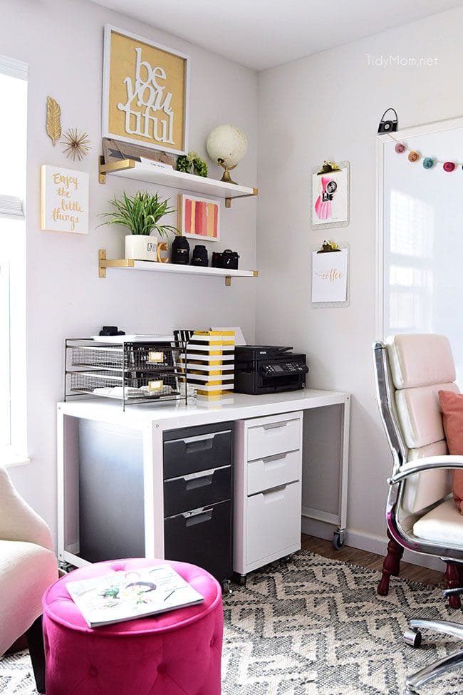 Decorating a shared office, with colorful industrial style. Her side is pink and gold, while his is black and neutrals. Check out the gold coffee cart!! Get all the details of this shared home office space at TidyMom.net