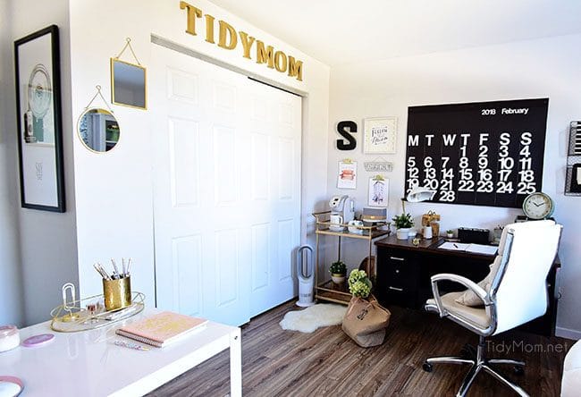 Decorating a shared office, with colorful industrial style. Her side is pink and gold, while his is black and neutrals. Check out the gold coffee cart!! Get all the details of this shared home office space at TidyMom.net
