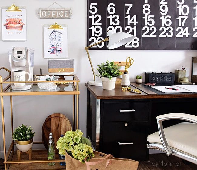 Decorating a shared home office, with colorful industrial style. Her side is pink and gold, while his is black and neutrals. Check out the gold coffee cart!! Get all the details of this shared home office space at TidyMom.net