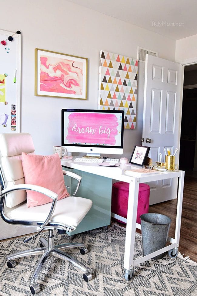 Decorating a shared office, with colorful industrial style. Her side is pink and gold, while his is black and neutrals. Check out the gold coffee cart!! Get all the details of this shared home office space at TidyMom.net