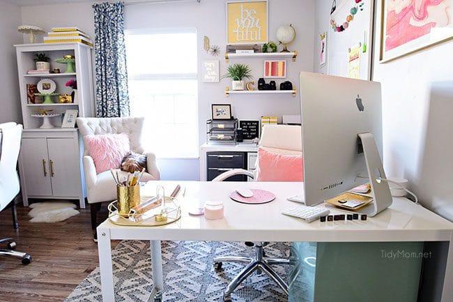 Decorating a shared office, with colorful industrial style. Her side is pink and gold, while his is black and neutrals. Check out the gold coffee cart!! Get all the details of this shared home office space at TidyMom.net