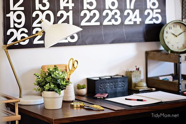 Decorating a shared office, with colorful industrial style. Her side is pink and gold, while his is black and neutrals. Check out the gold coffee cart!! Get all the details of this shared home office space at TidyMom.net